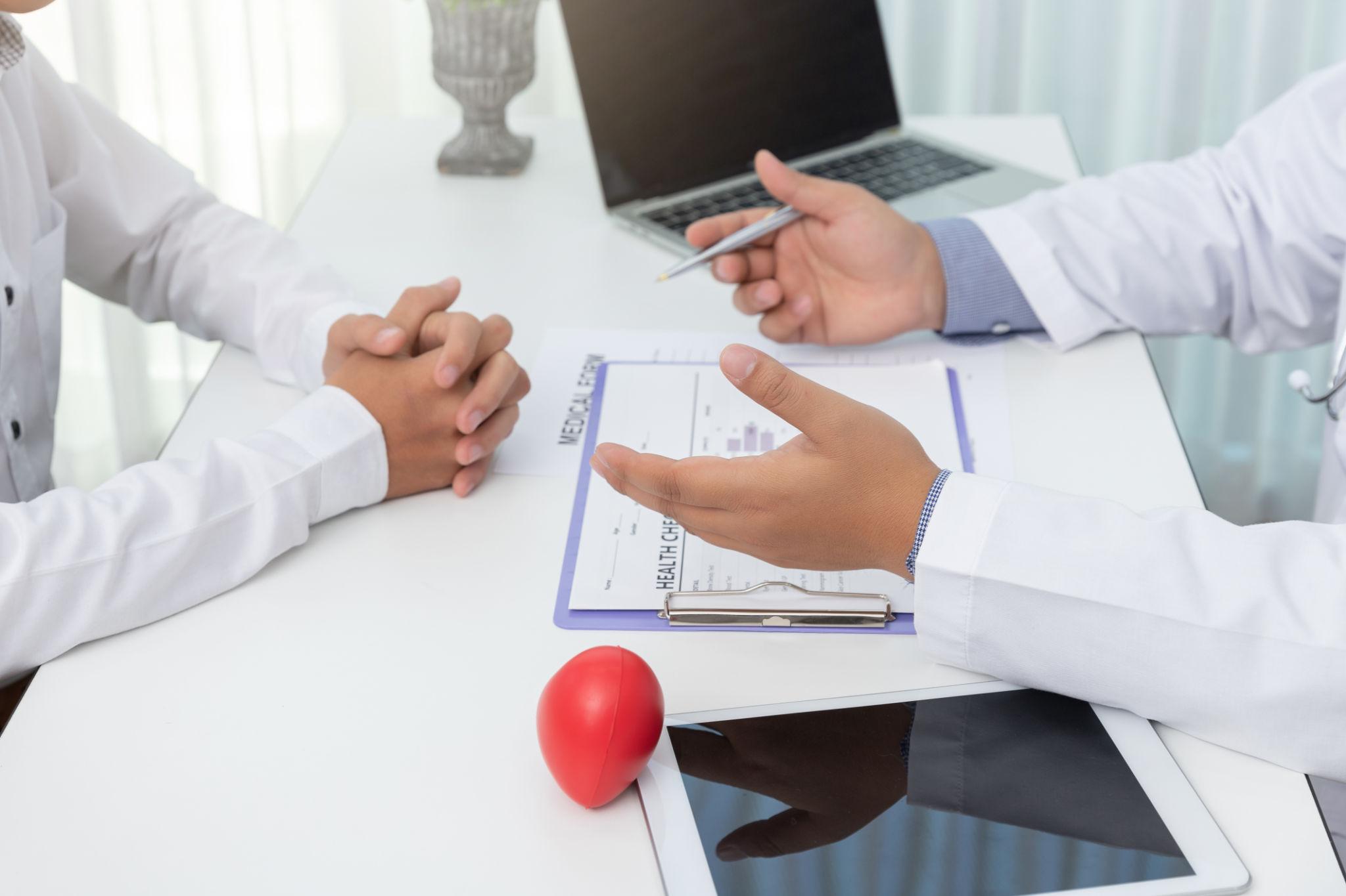 doctors sitting across each other
